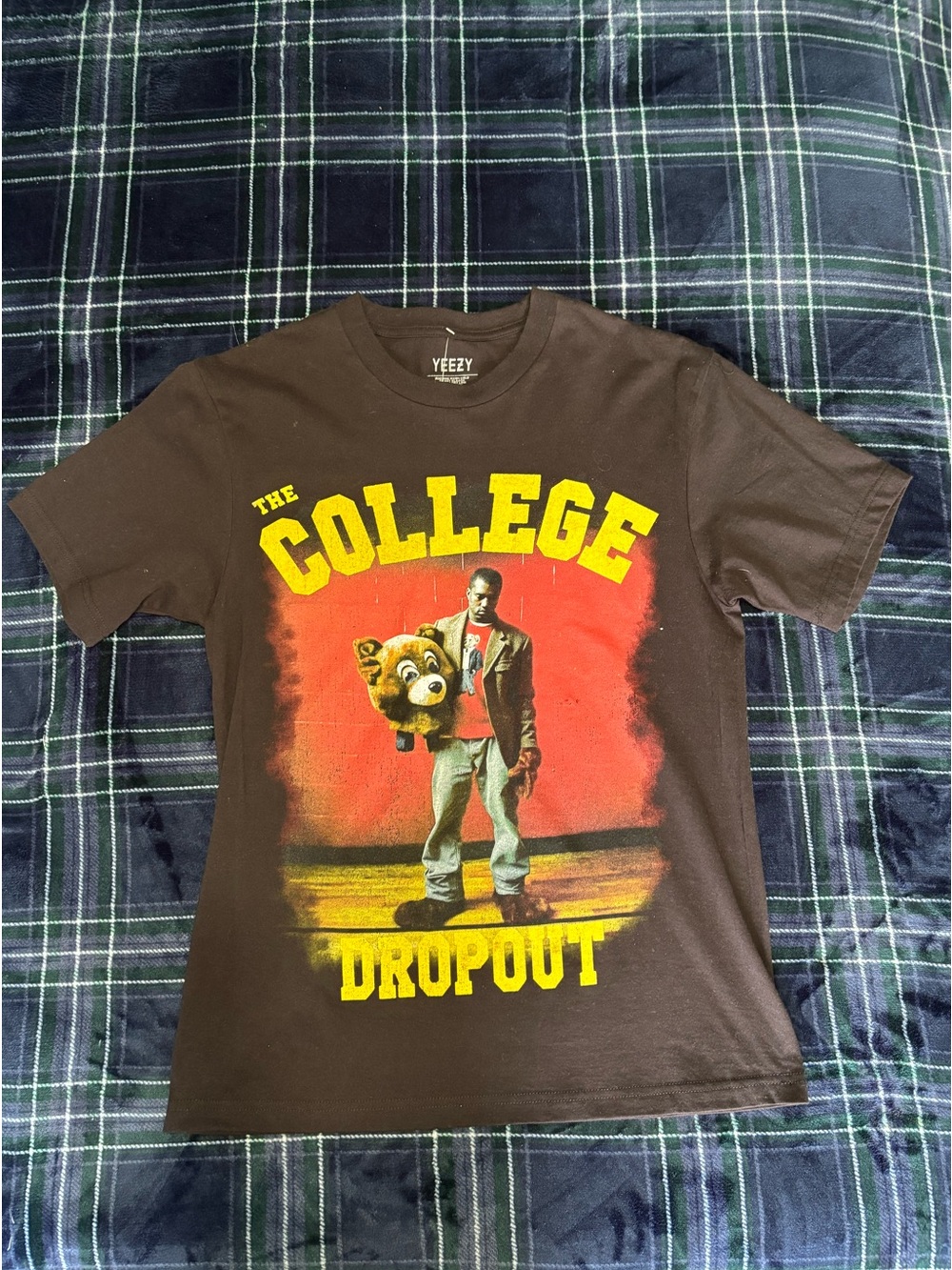 The College Dropout  shirt graphic of Kanye West holding the album's bear mascot